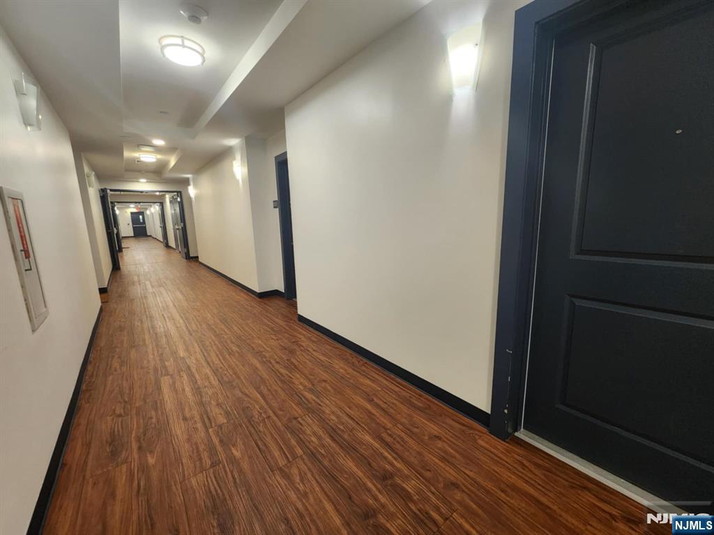 77 Ridge, Unit 306 North Arlington, NJ 07031 - Photo 23 of 23 a view of gallery with wooden floor