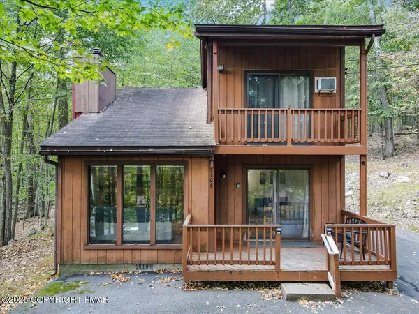 a view of a house with porch and wooden floor