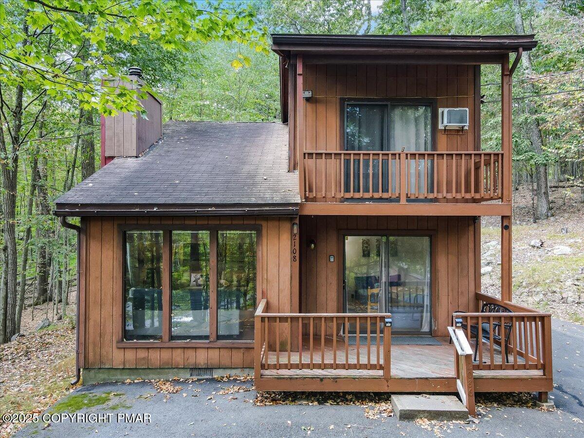 a view of a house with porch and wooden floor