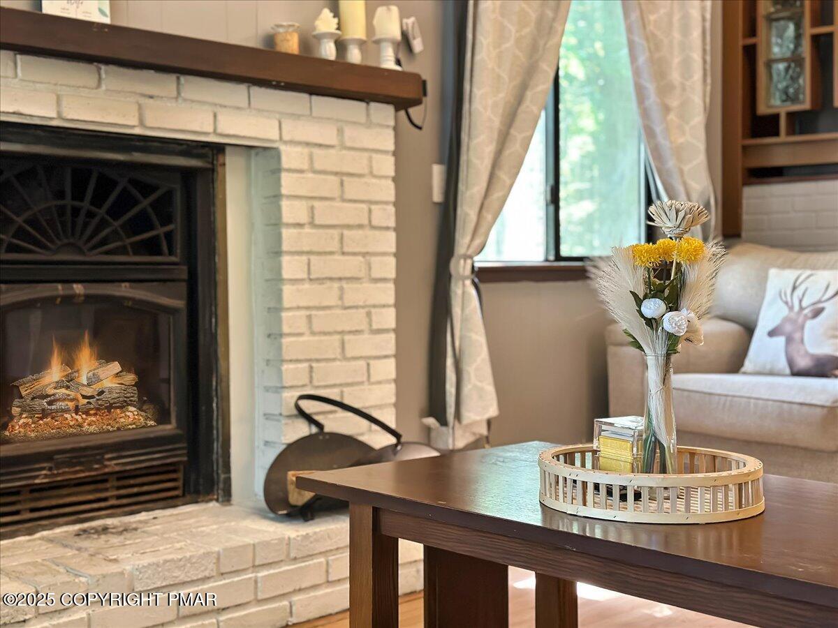2108 Scarborough Way Bushkill, PA 18324 - Photo 14 of 105 a living room with furniture and a fireplace