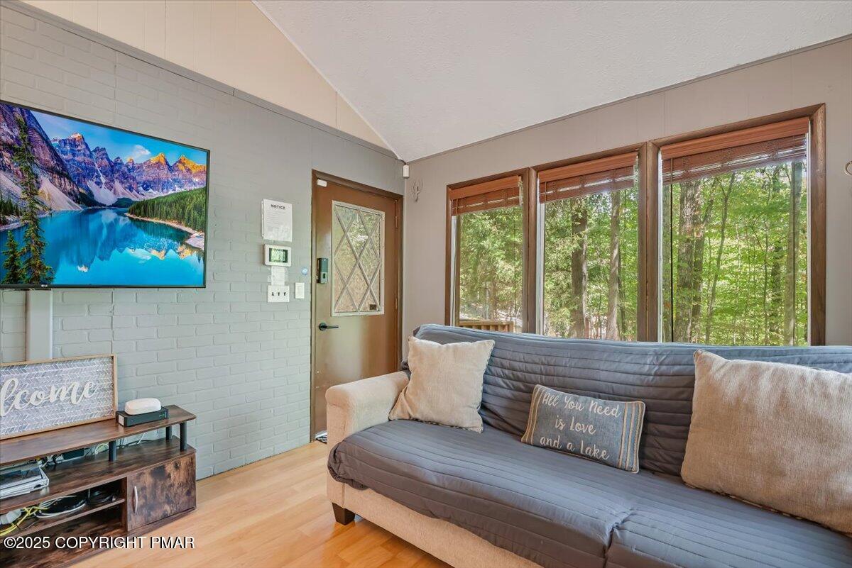 2108 Scarborough Way Bushkill, PA 18324 - Photo 16 of 105 a living room with furniture and a large window