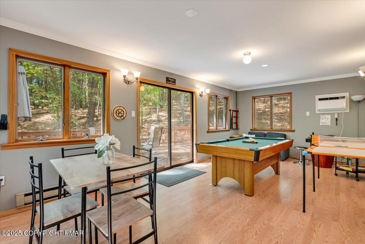 2108 Scarborough Way Bushkill, PA 18324 - Photo 30 of 105 a living room with furniture a rug and a large window