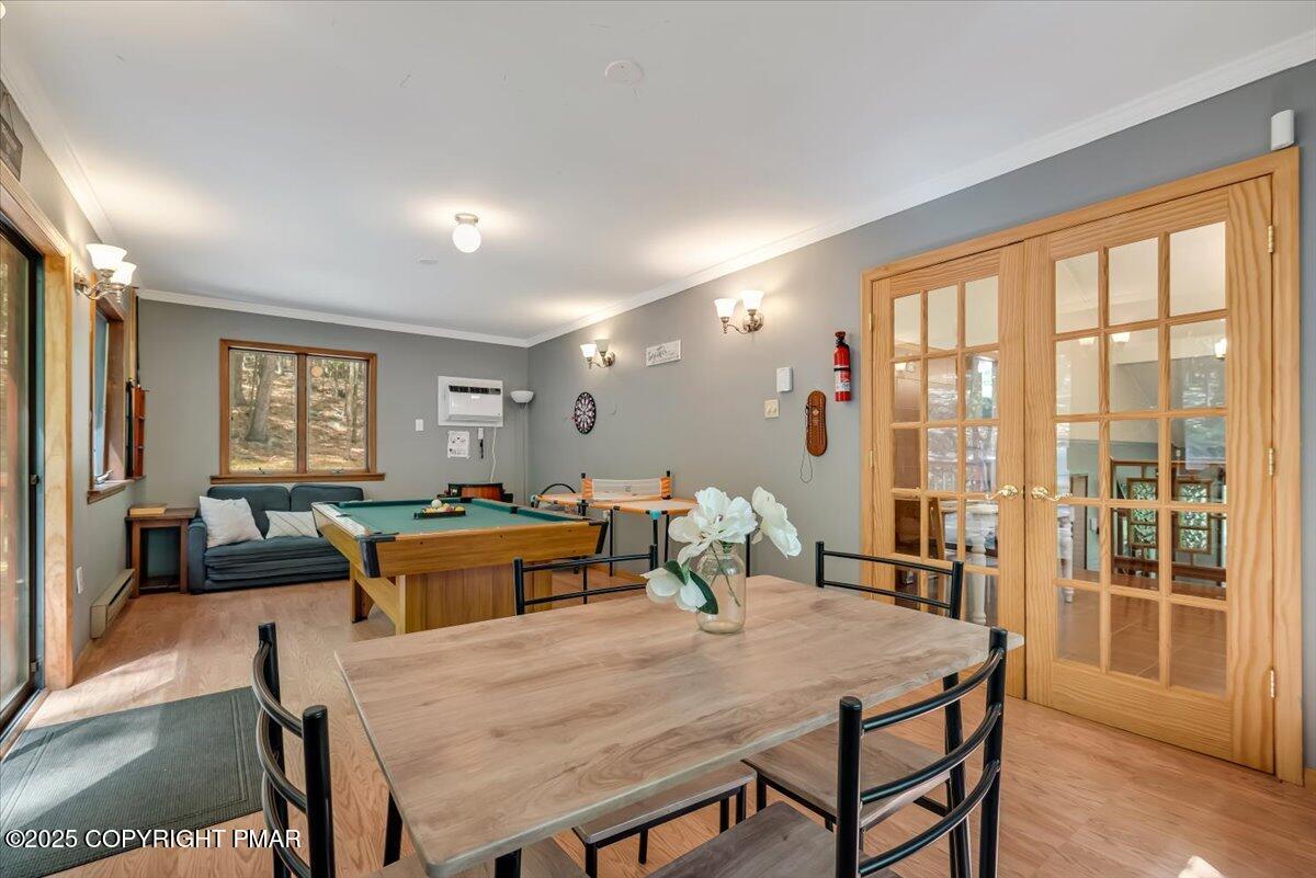 2108 Scarborough Way Bushkill, PA 18324 - Photo 35 of 105 a view of a dining room with furniture window and outside view