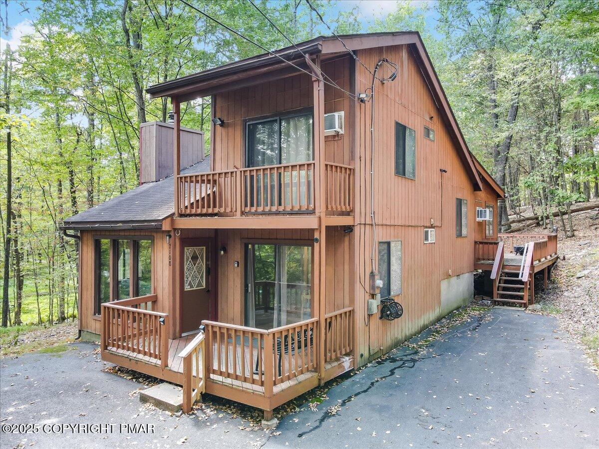 2108 Scarborough Way Bushkill, PA 18324 - Photo 4 of 105 a view of a house with a yard and wooden deck