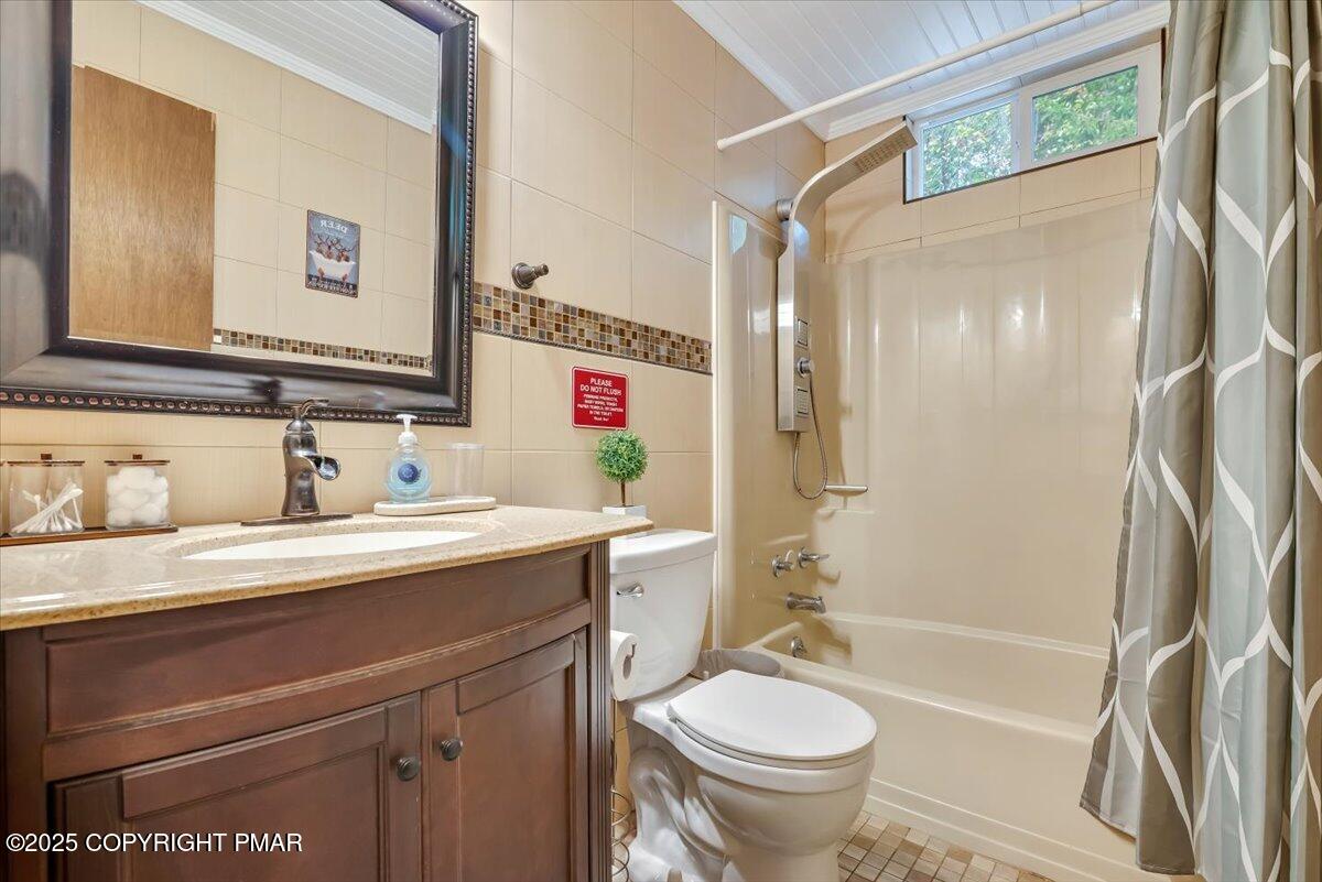2108 Scarborough Way Bushkill, PA 18324 - Photo 41 of 105 a bathroom with a sink a toilet and a mirror
