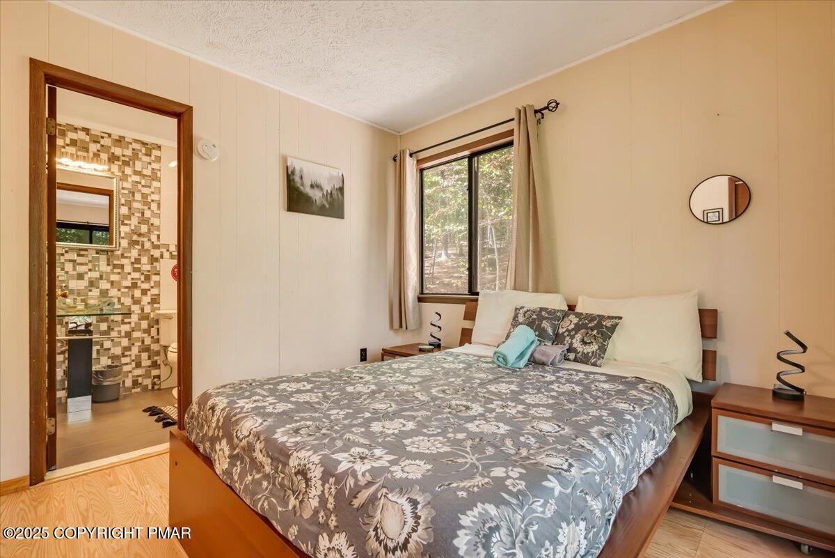 2108 Scarborough Way Bushkill, PA 18324 - Photo 48 of 105 a bedroom with a bed and a window