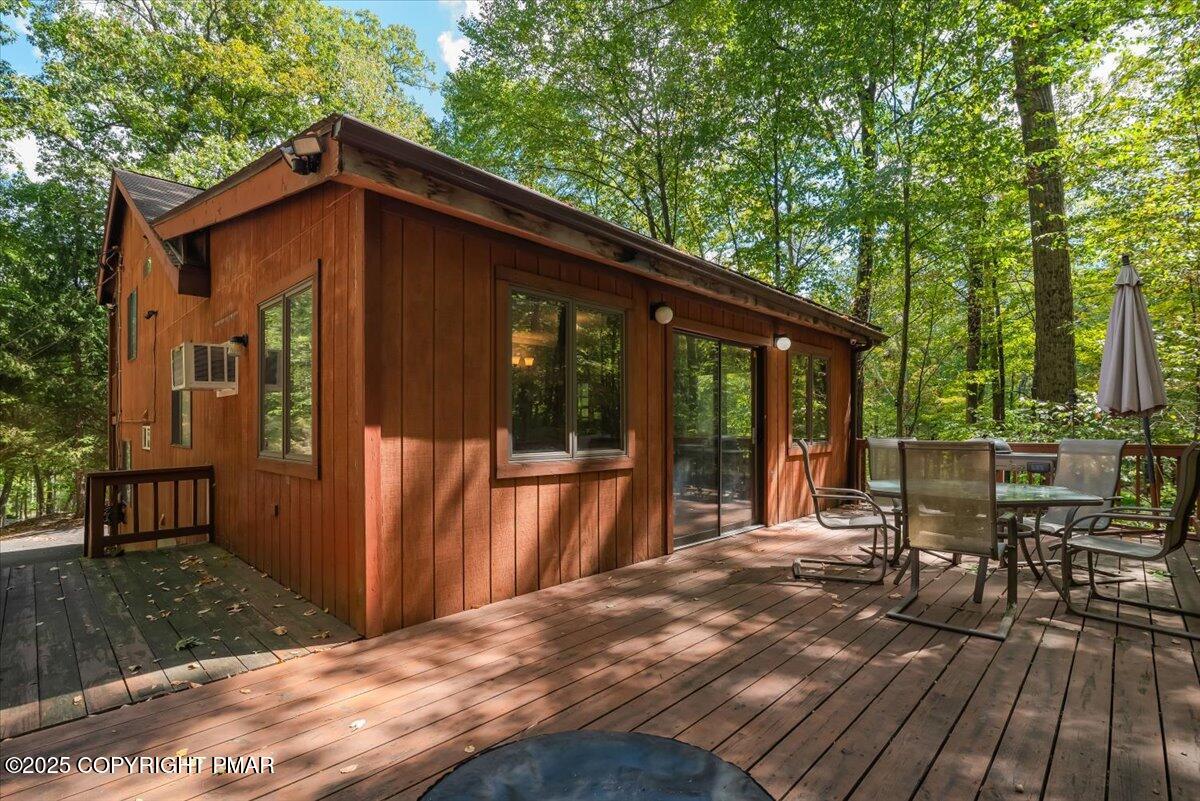 2108 Scarborough Way Bushkill, PA 18324 - Photo 54 of 105 a view of a house with backyard porch and sitting area