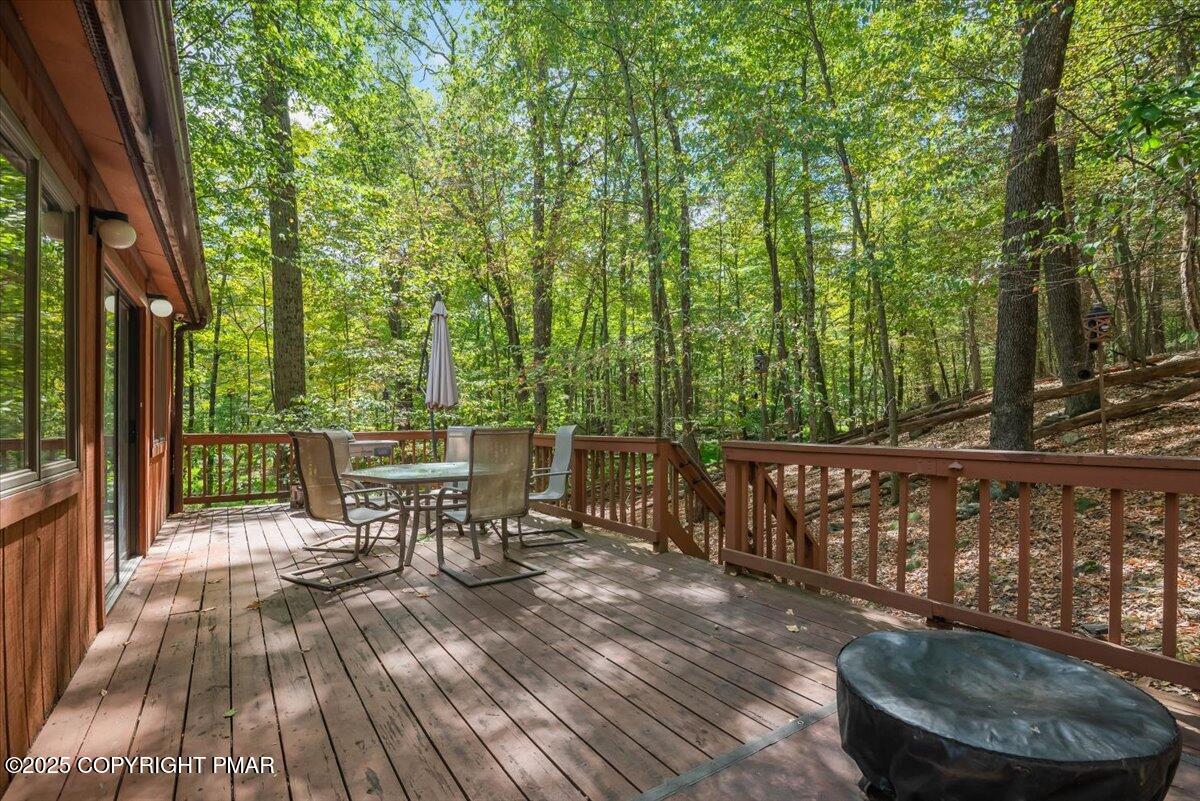 2108 Scarborough Way Bushkill, PA 18324 - Photo 57 of 105 a view of a chairs and table on the wooden deck