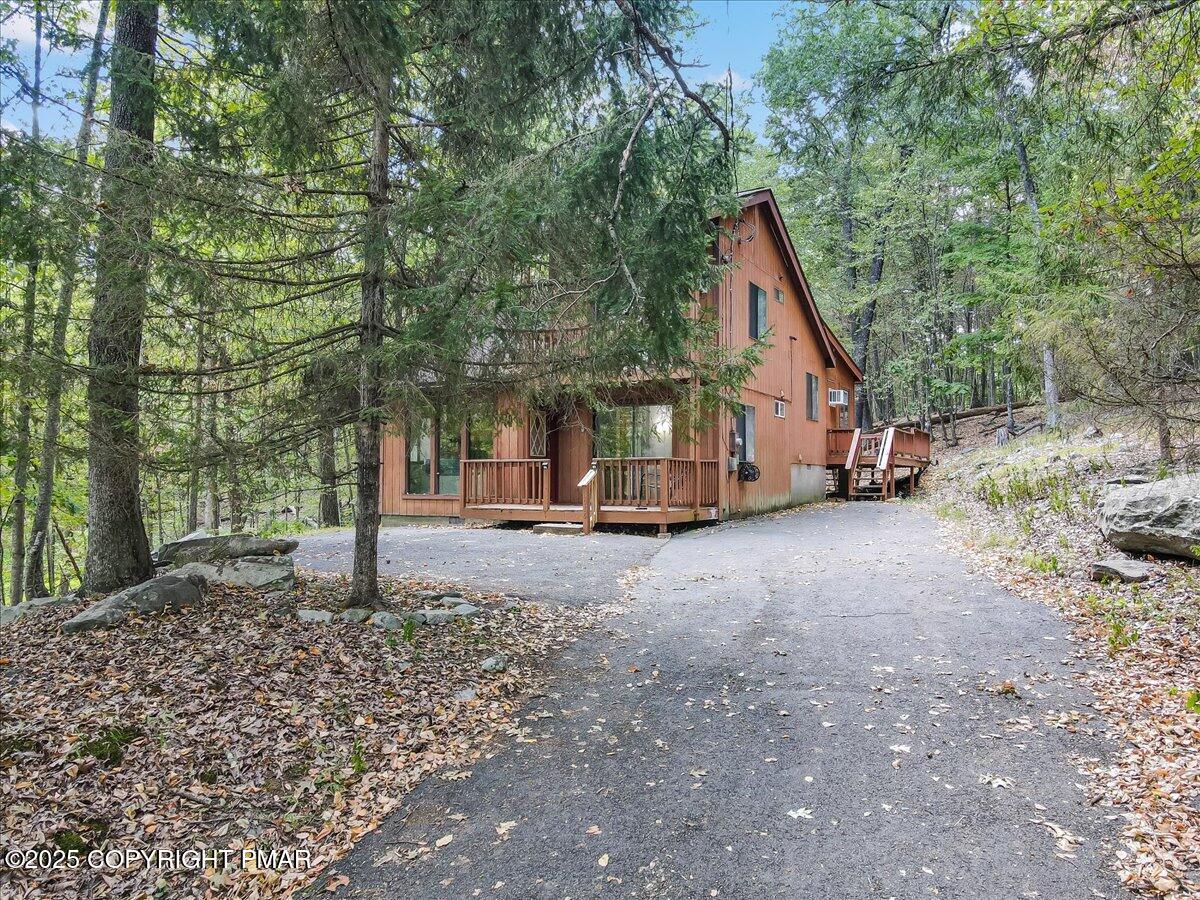 2108 Scarborough Way Bushkill, PA 18324 - Photo 72 of 105 a view of a house with a yard and tree