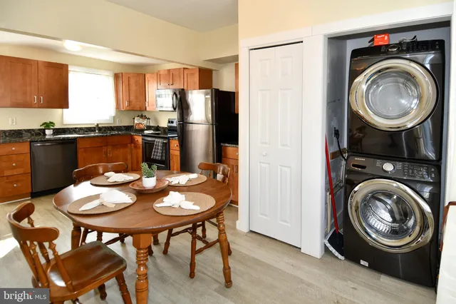 a kitchen with a table and chairs in it