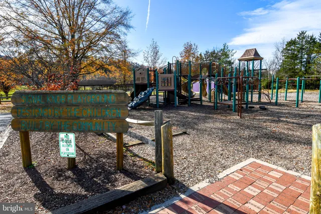 a view of a park with iron fence