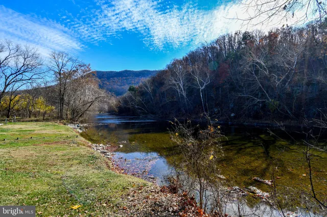 a view of swimming pool with a yard