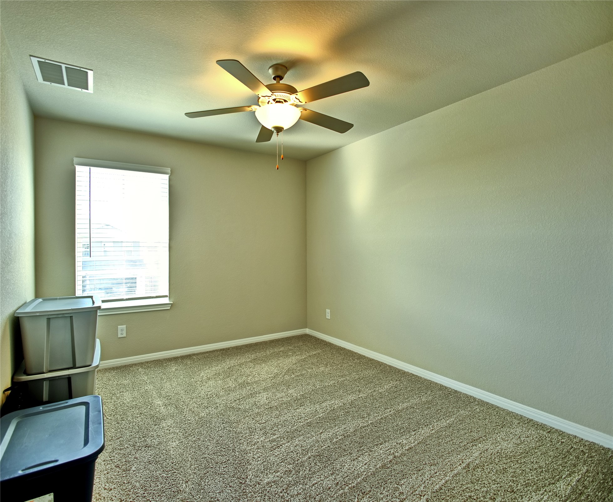 2809 Moyer Lane Round Rock, TX 78665 - Photo 14 of 22 Carpeted empty room with ceiling fan and a textured ceiling
