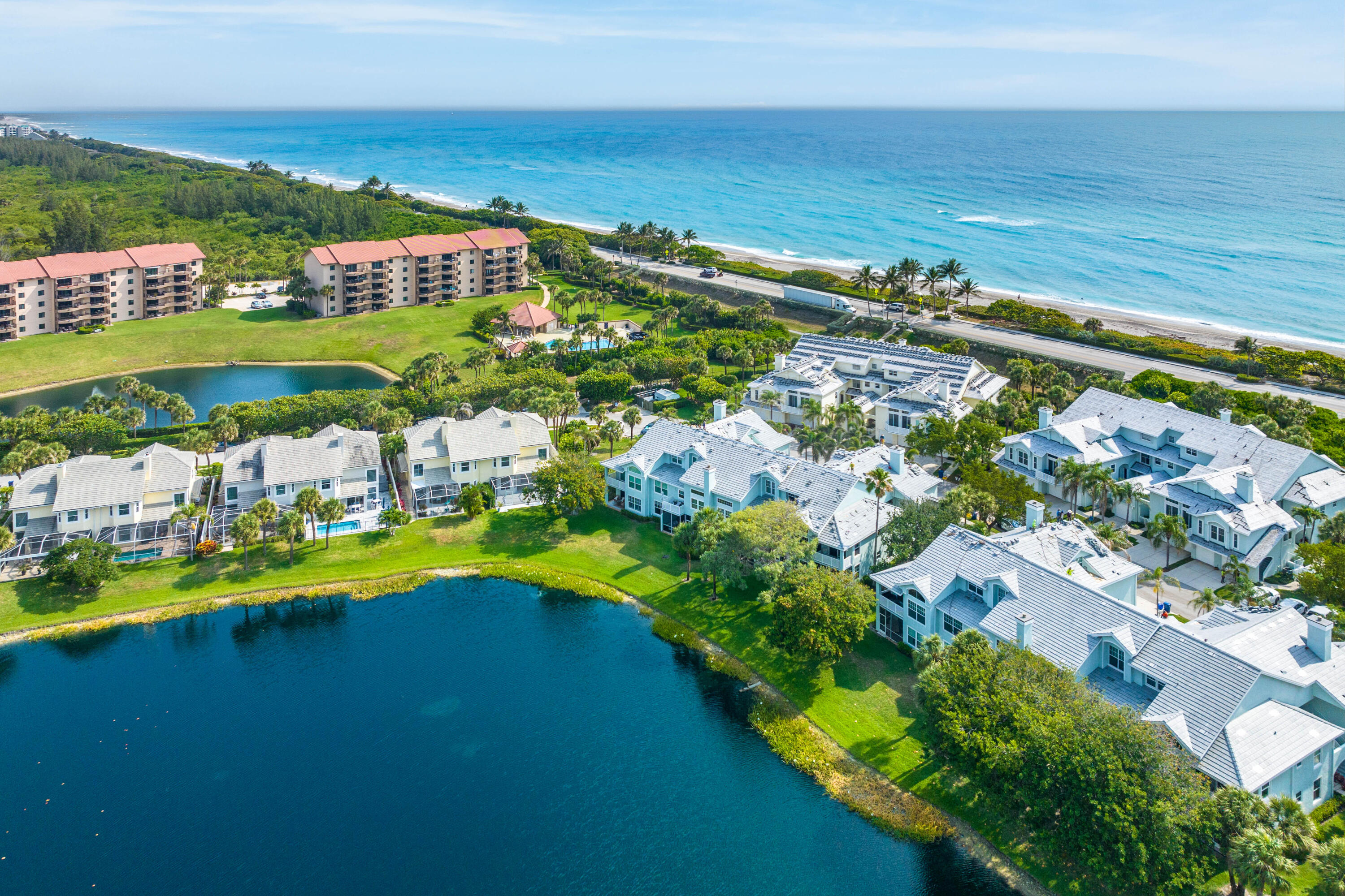 807 Mainsail Circle Jupiter, FL 33477 - Photo 1 of 35 a view of a city with lots of residential buildings ocean and mountain view in back