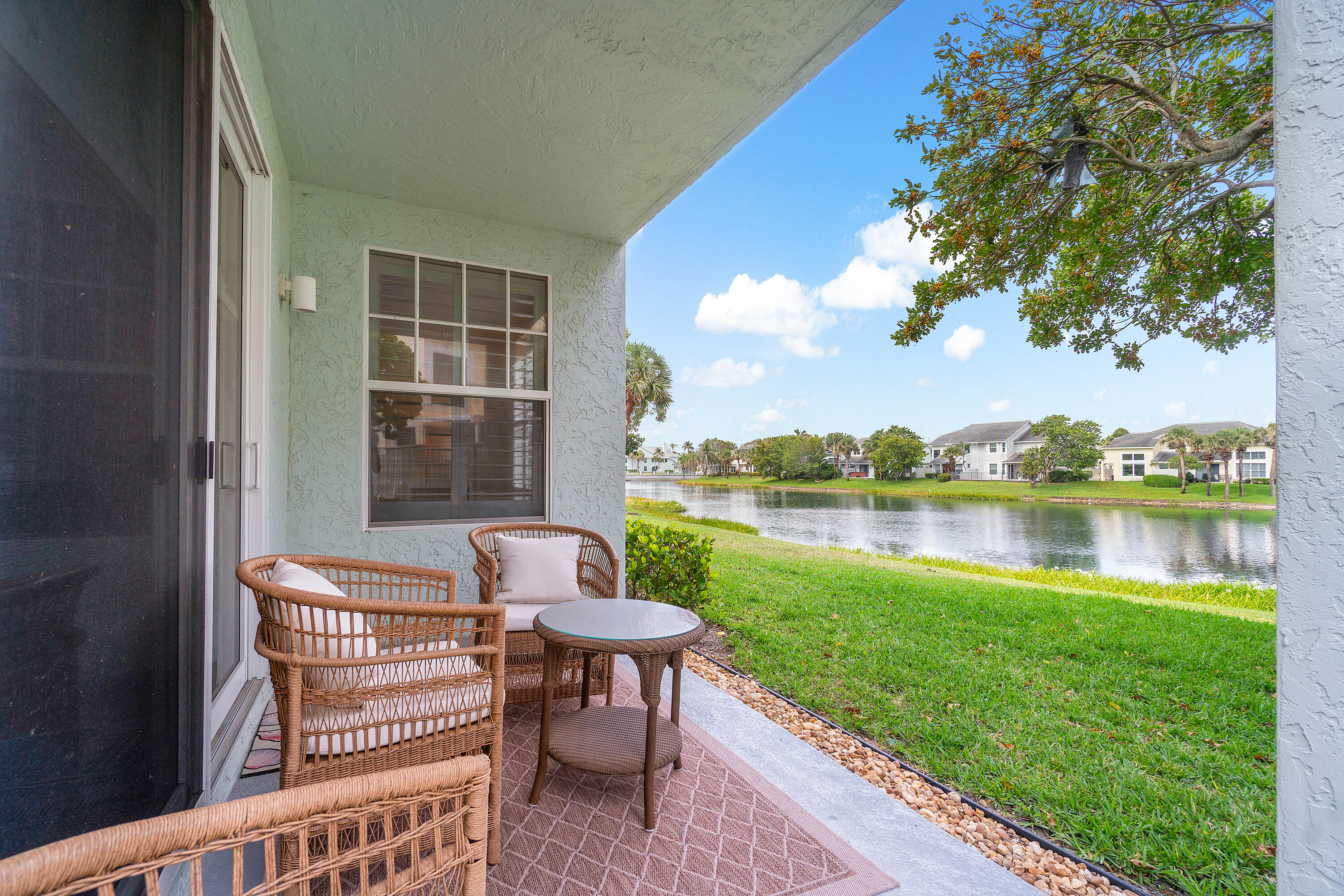 807 Mainsail Circle Jupiter, FL 33477 - Photo 25 of 35 a balcony with table and chairs