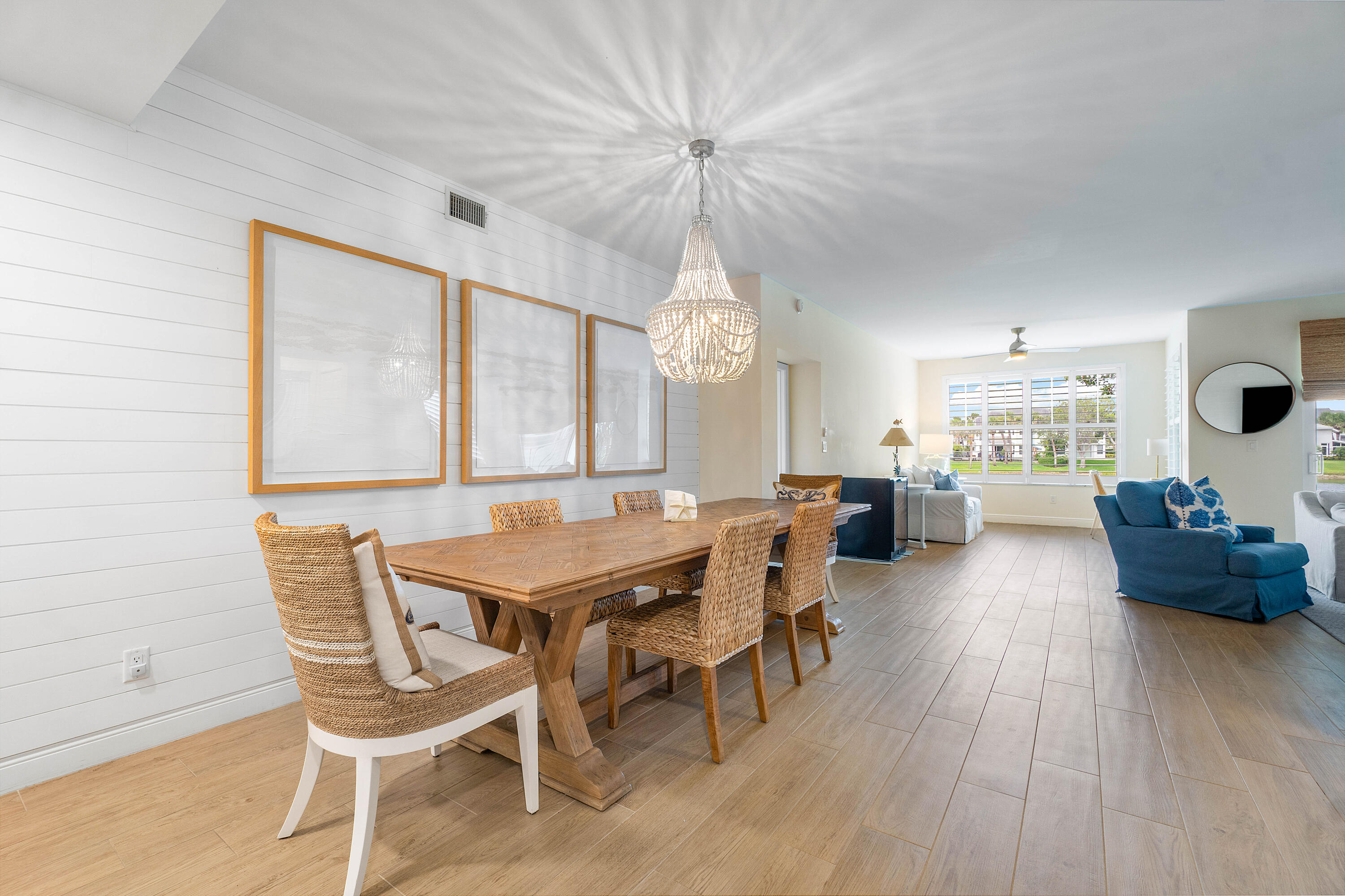 807 Mainsail Circle Jupiter, FL 33477 - Photo 5 of 35 a dining room with furniture and wooden floor