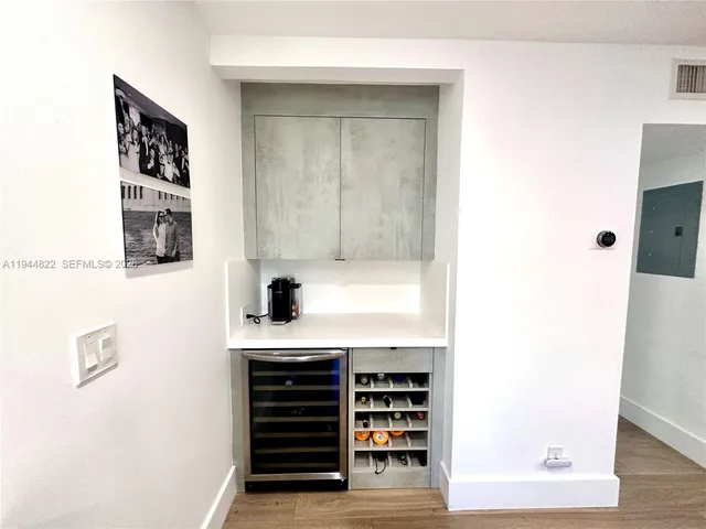 a kitchen with a refrigerator and a window