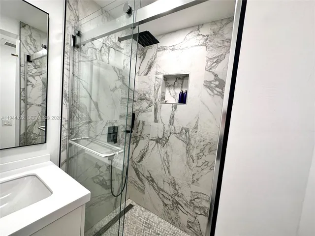 a bathroom with a tub and shower