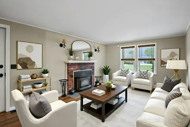a living room with furniture a fireplace and a window
