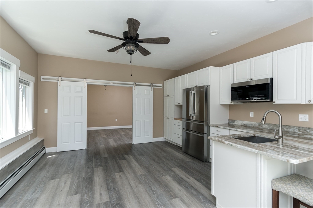 77 Barrel Road Westminster, MA 01473 - Photo 22 of 42 a kitchen with a refrigerator and a sink