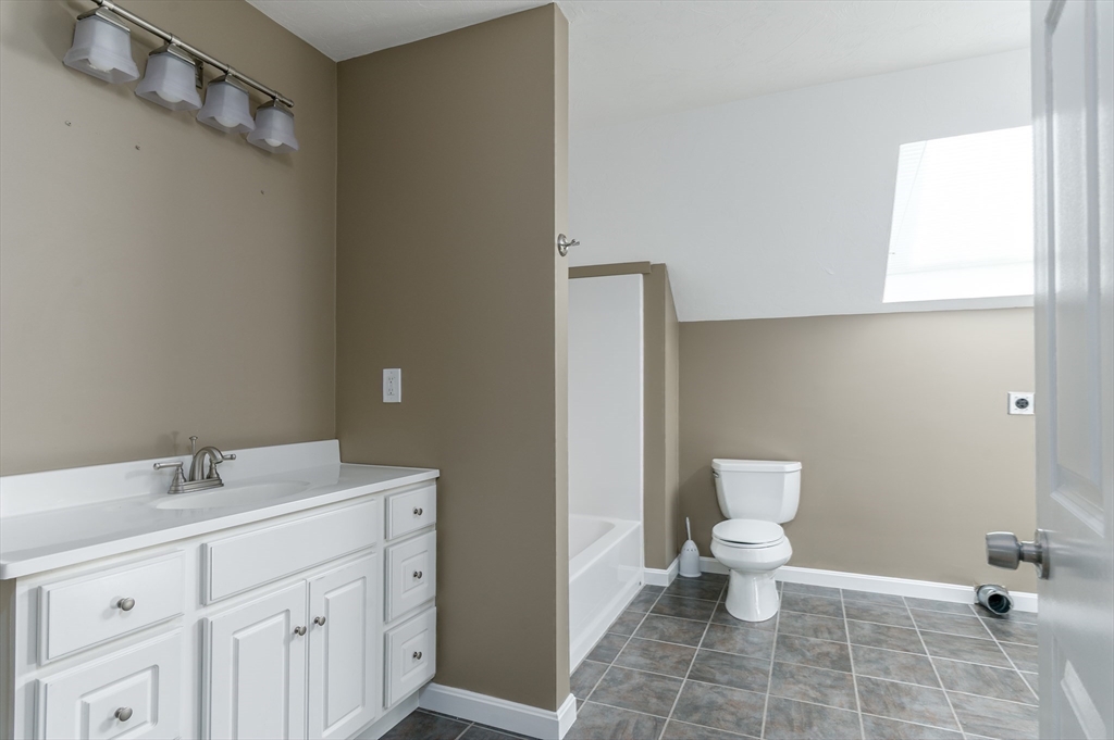 77 Barrel Road Westminster, MA 01473 - Photo 25 of 42 a bathroom with a sink toilet and vanity