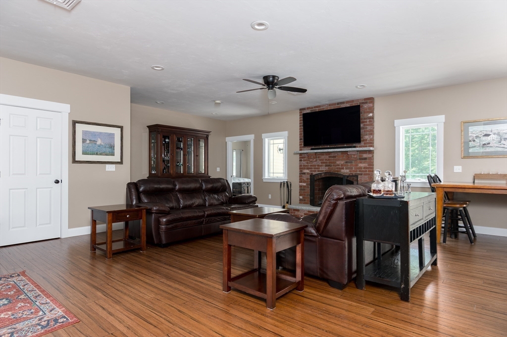 77 Barrel Road Westminster, MA 01473 - Photo 8 of 42 a living room with furniture a flat screen tv and a fireplace