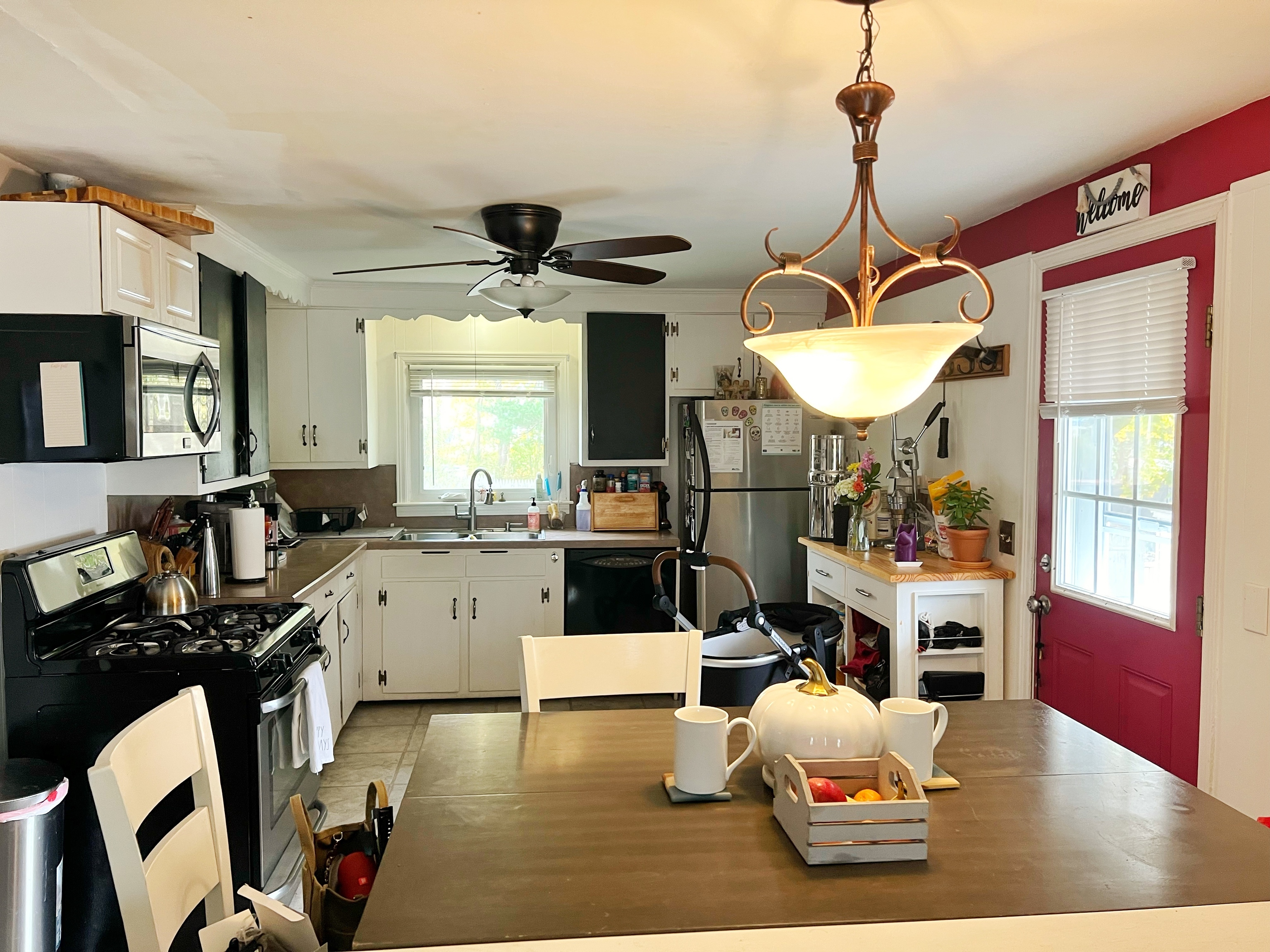 118 Bannon Street Torrington, CT 06790 - Photo 11 of 27 a living room with furniture a chandelier and a flat screen tv