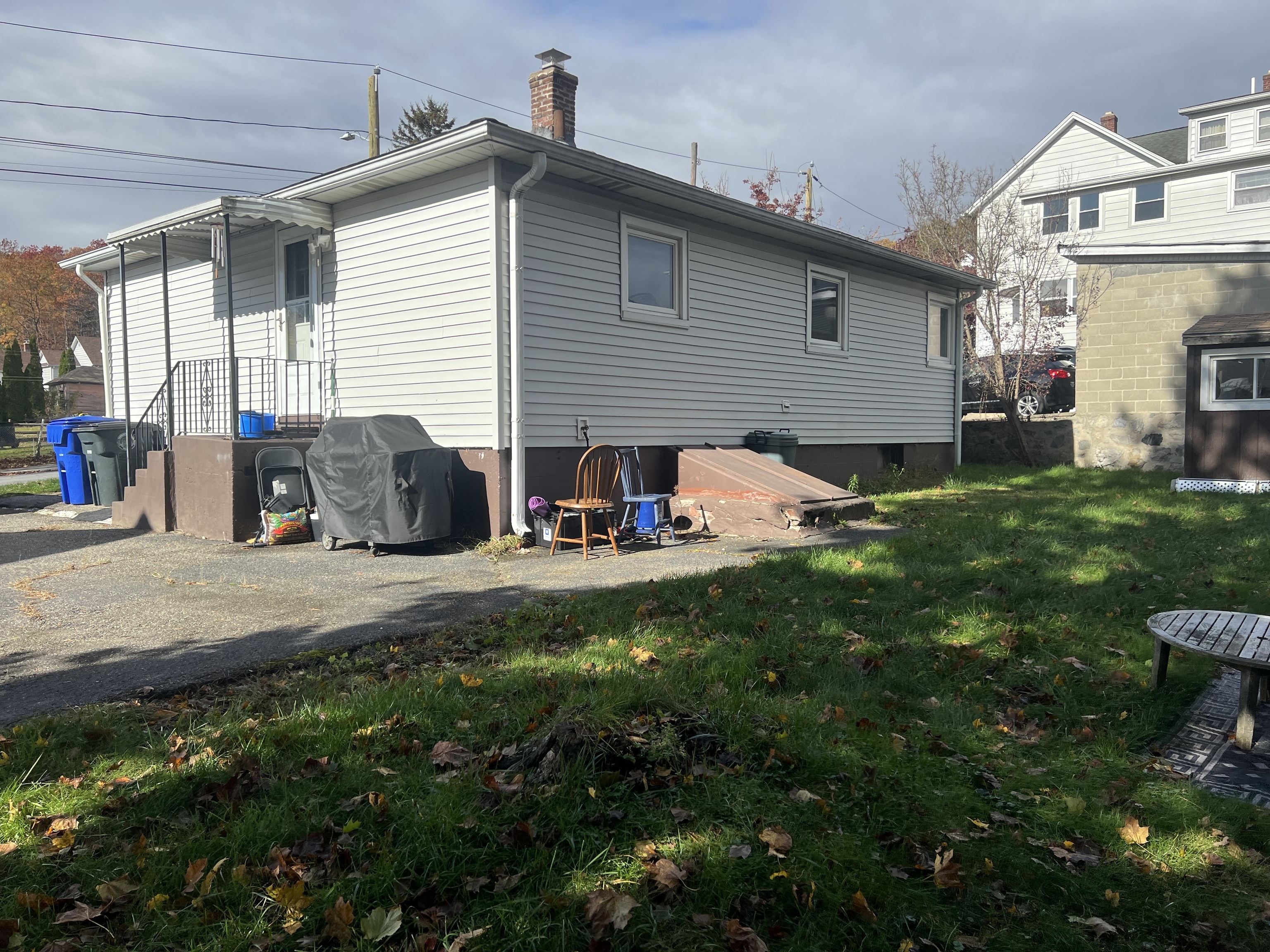118 Bannon Street Torrington, CT 06790 - Photo 27 of 27 a backyard of a house with table and chairs