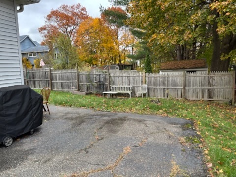 118 Bannon Street Torrington, CT 06790 - Photo 9 of 27 a view of a backyard with wooden fence