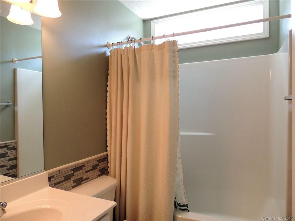 56 Morning Mist Road, Unit 76 Fletcher, NC 28732 - Photo 15 of 16 a bathroom with a shower and a sink