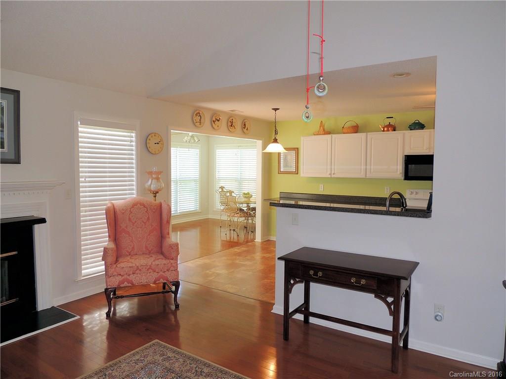 56 Morning Mist Road, Unit 76 Fletcher, NC 28732 - Photo 4 of 16 a hallway with a table and chairs