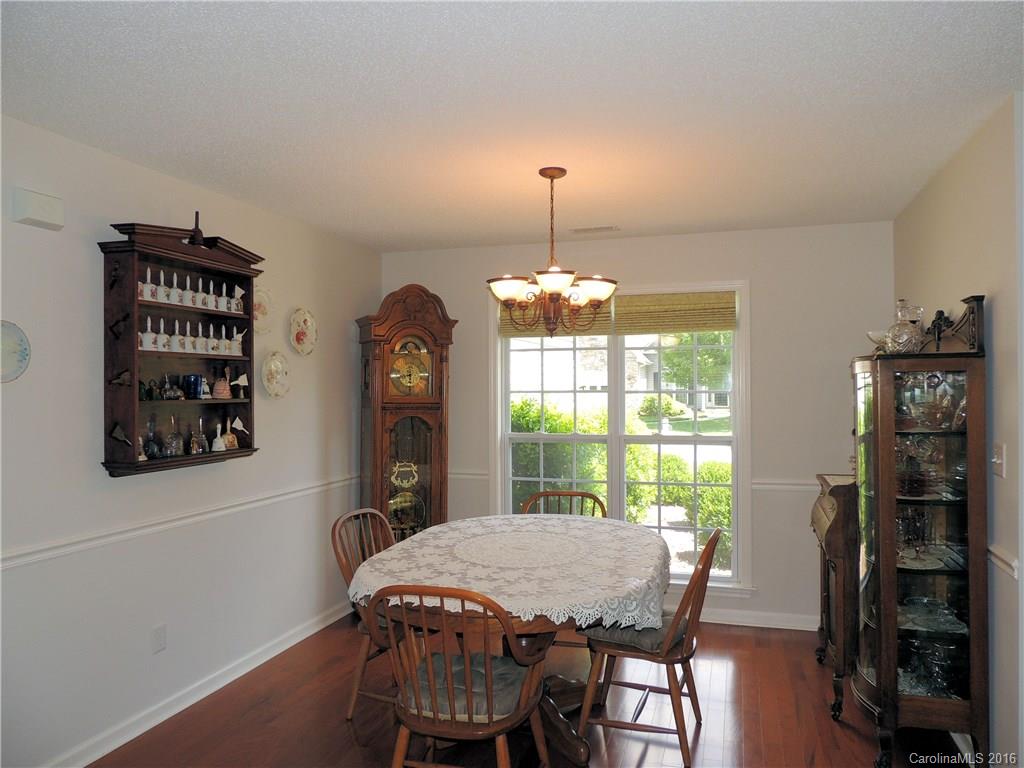 56 Morning Mist Road, Unit 76 Fletcher, NC 28732 - Photo 10 of 16 a view of a dining room with furniture window and wooden floor
