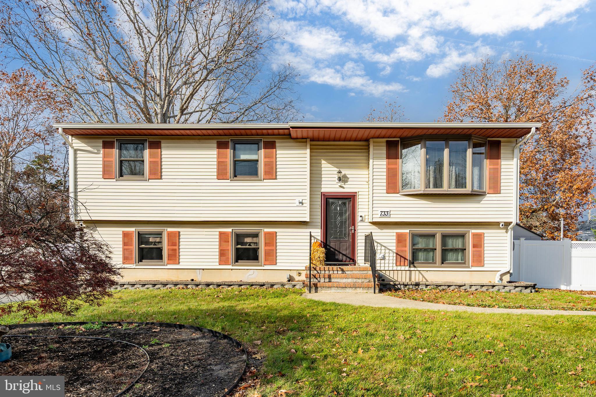 a house that has a big yard in front of it
