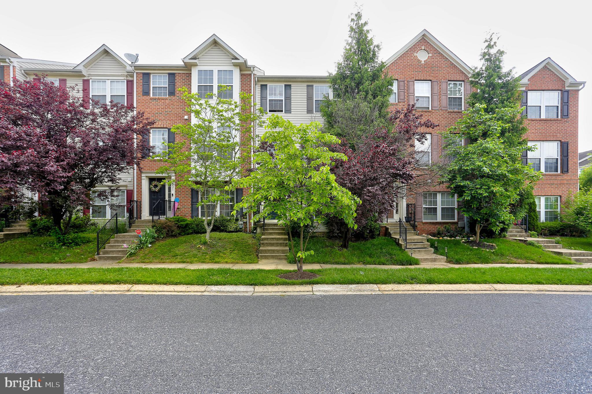 819 Lowe Road Middle River, MD 21220 - Photo 1 of 26 a front view of a house with a yard and garage