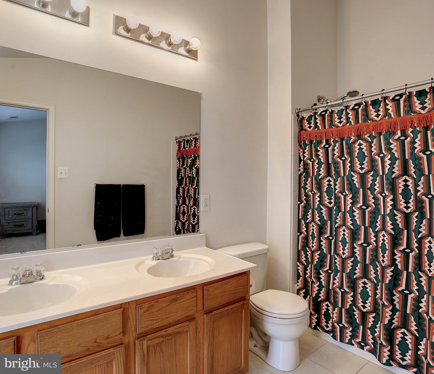 819 Lowe Road Middle River, MD 21220 - Photo 16 of 26 a bathroom with a sink and a toilet