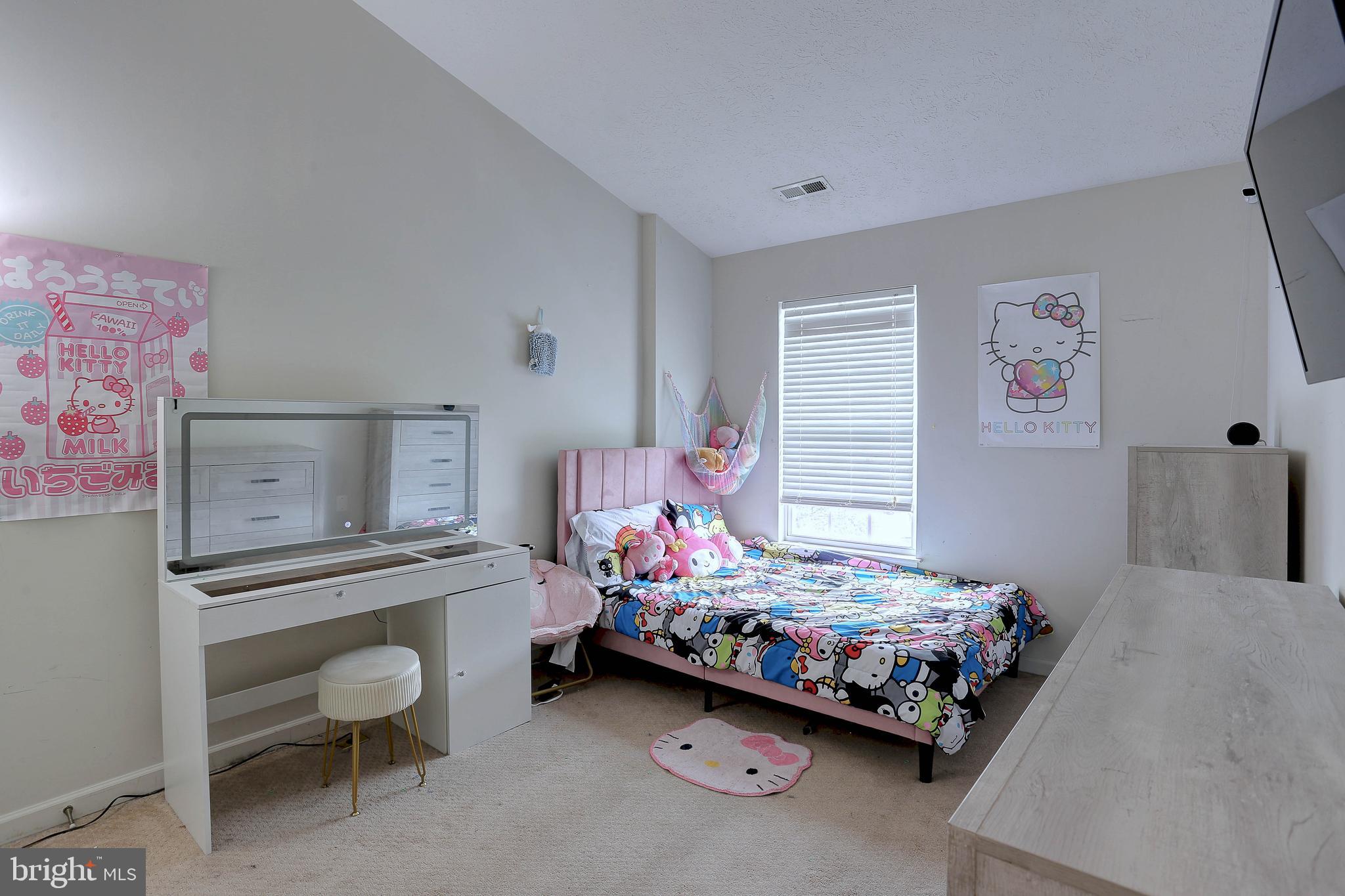 819 Lowe Road Middle River, MD 21220 - Photo 18 of 26 a bedroom with a bed and a table in it