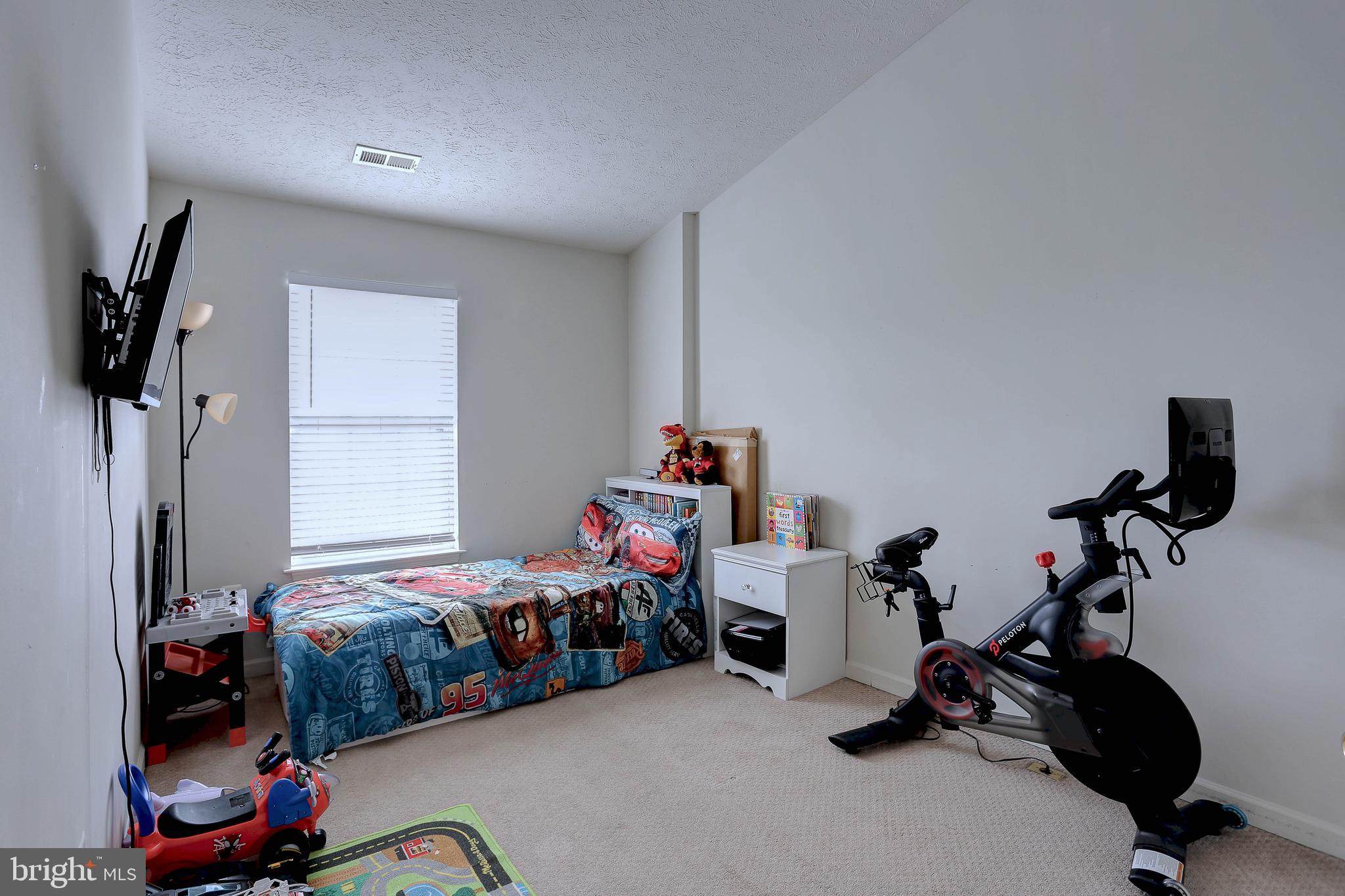 819 Lowe Road Middle River, MD 21220 - Photo 20 of 26 a bedroom with bed a flat tv screen and a view of bedroom