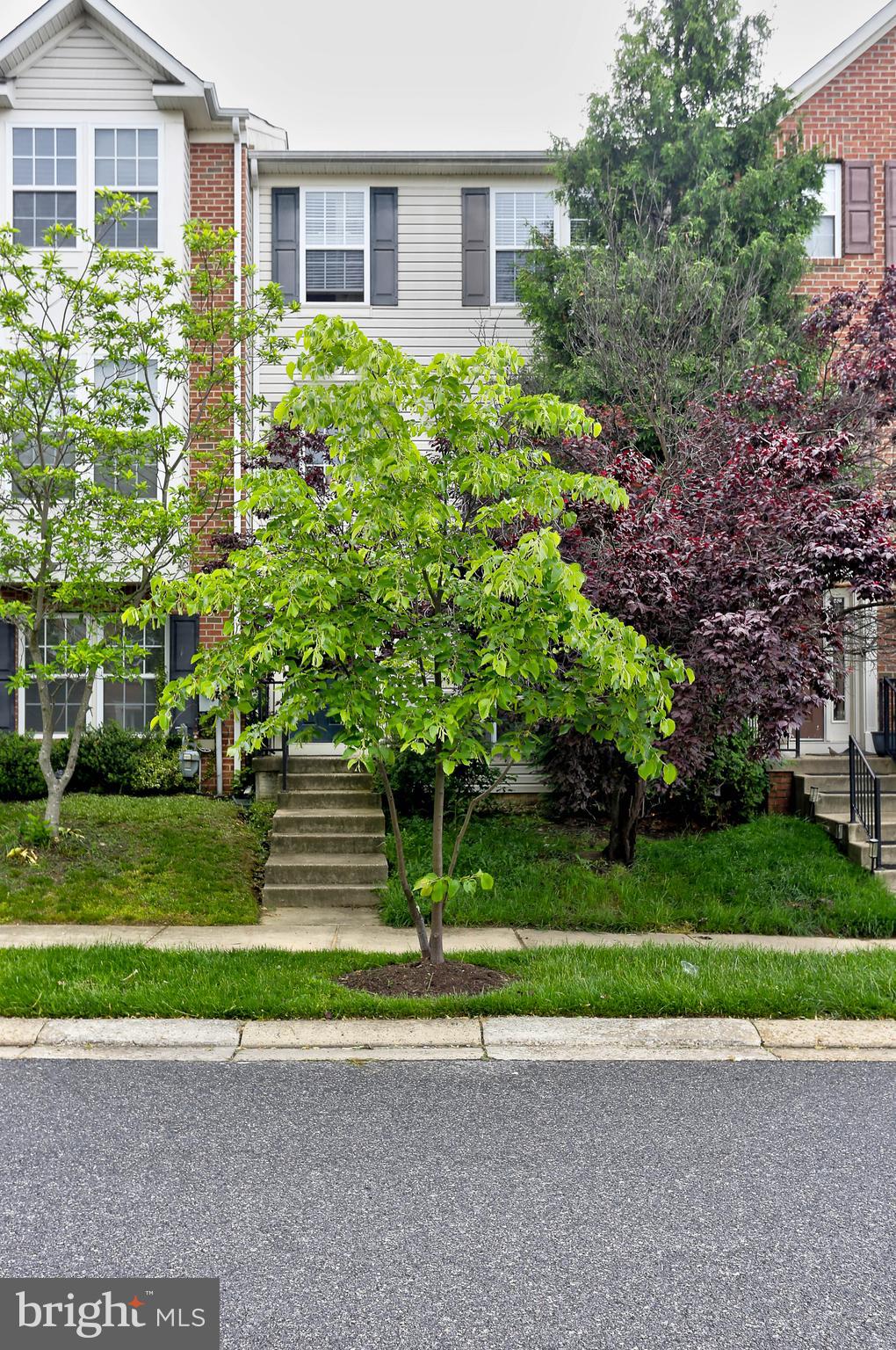 819 Lowe Road Middle River, MD 21220 - Photo 3 of 26 a front view of a house with a yard and a garage
