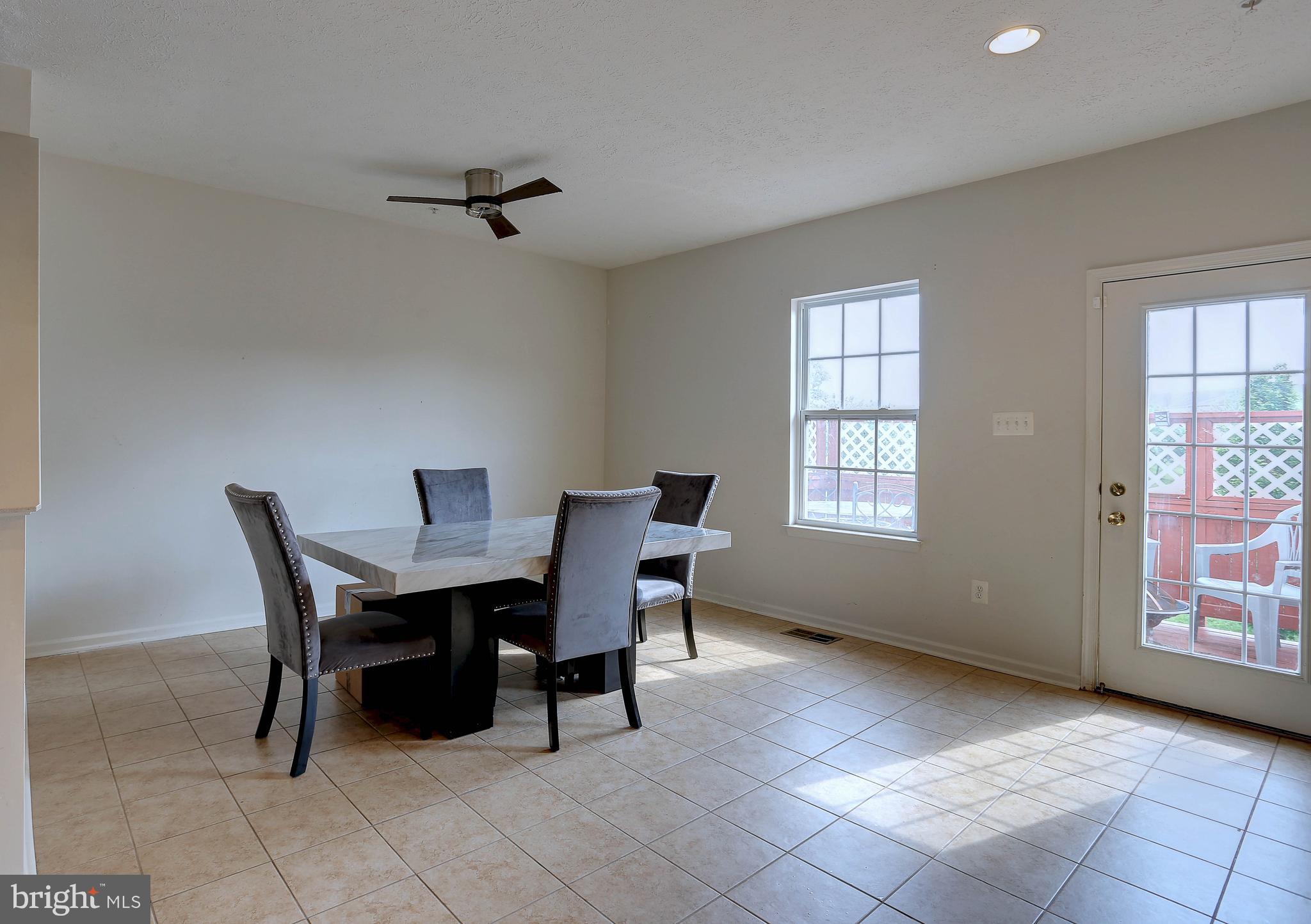 819 Lowe Road Middle River, MD 21220 - Photo 8 of 26 a dining room with furniture and window