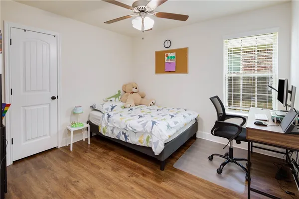 a bedroom with a bed and a table