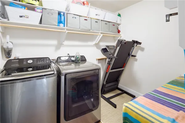 a utility room with dryer and washer