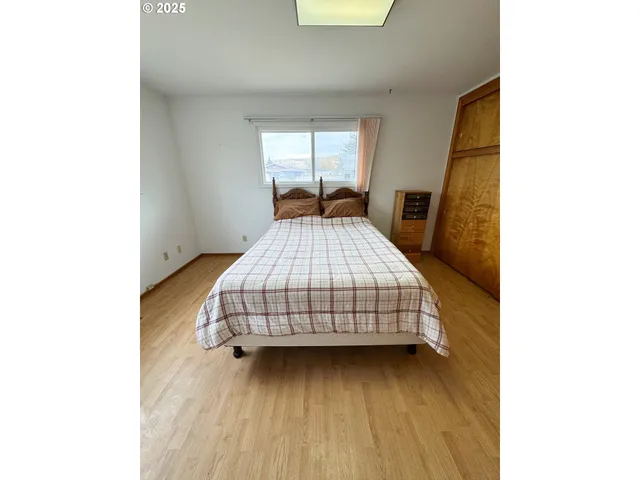 a room with a bed and a window