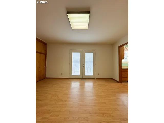 a view of an empty room with a window