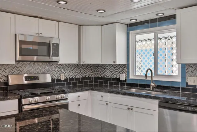 a view of a room with wooden floor and balcony