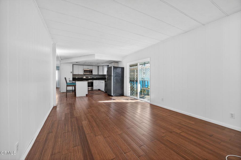 5540 West 5th Street, Unit 111 Oxnard, CA 93035 - Photo 15 of 35 a view of empty room with wooden floor and fan