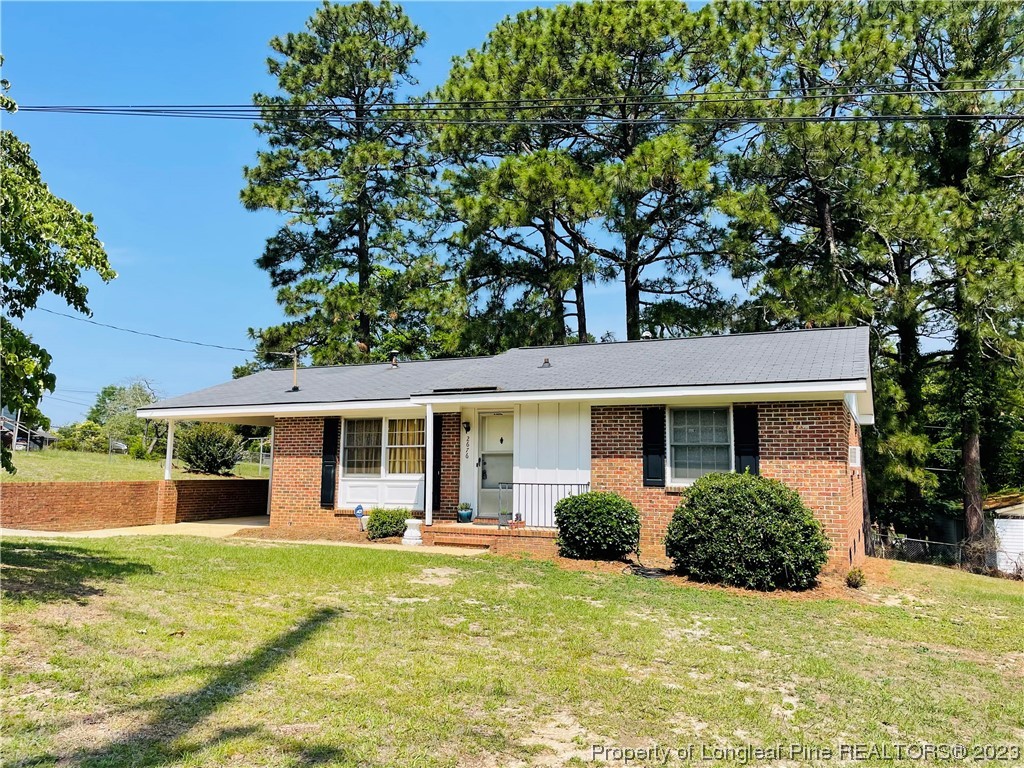 2676 Eldorado Road Fayetteville, NC 28306 - Photo 1 of 19 a view of a house with a backyard