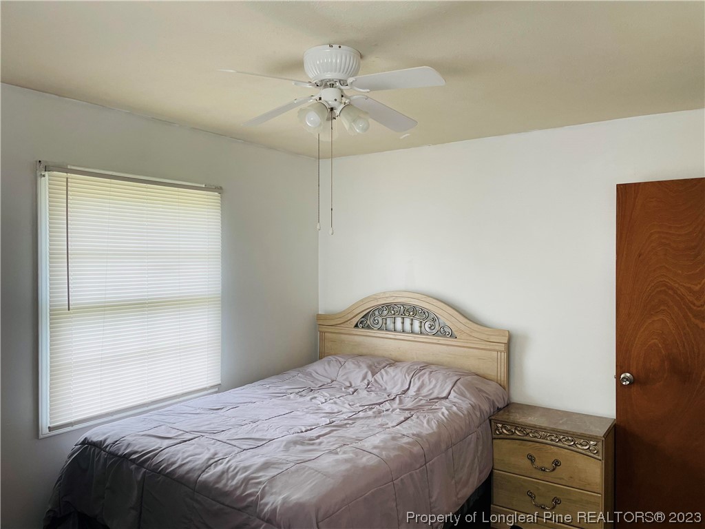 2676 Eldorado Road Fayetteville, NC 28306 - Photo 13 of 19 a bedroom with a bed and a window