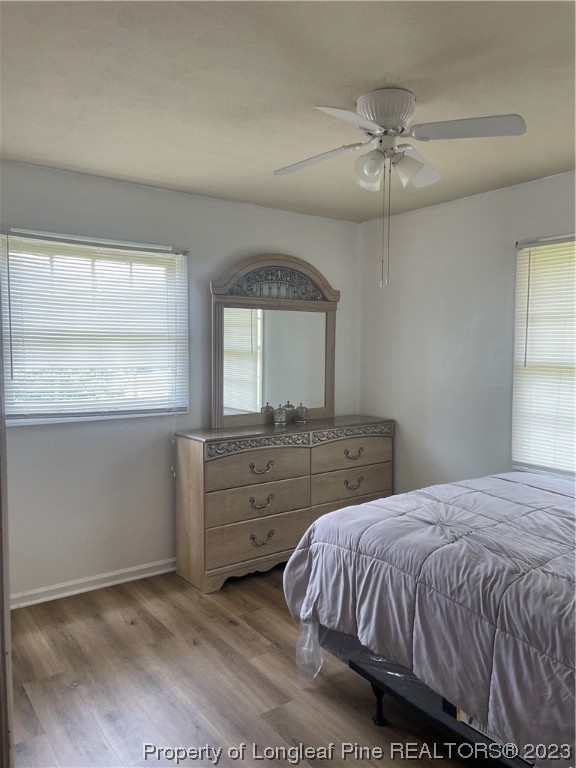 2676 Eldorado Road Fayetteville, NC 28306 - Photo 15 of 19 a bedroom with a bed and a mirror