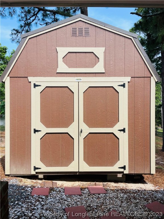 2676 Eldorado Road Fayetteville, NC 28306 - Photo 16 of 19 a view of a wooden door with a wooden fence