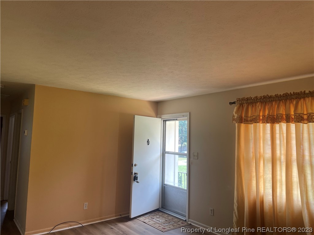 2676 Eldorado Road Fayetteville, NC 28306 - Photo 5 of 19 an empty room with windows